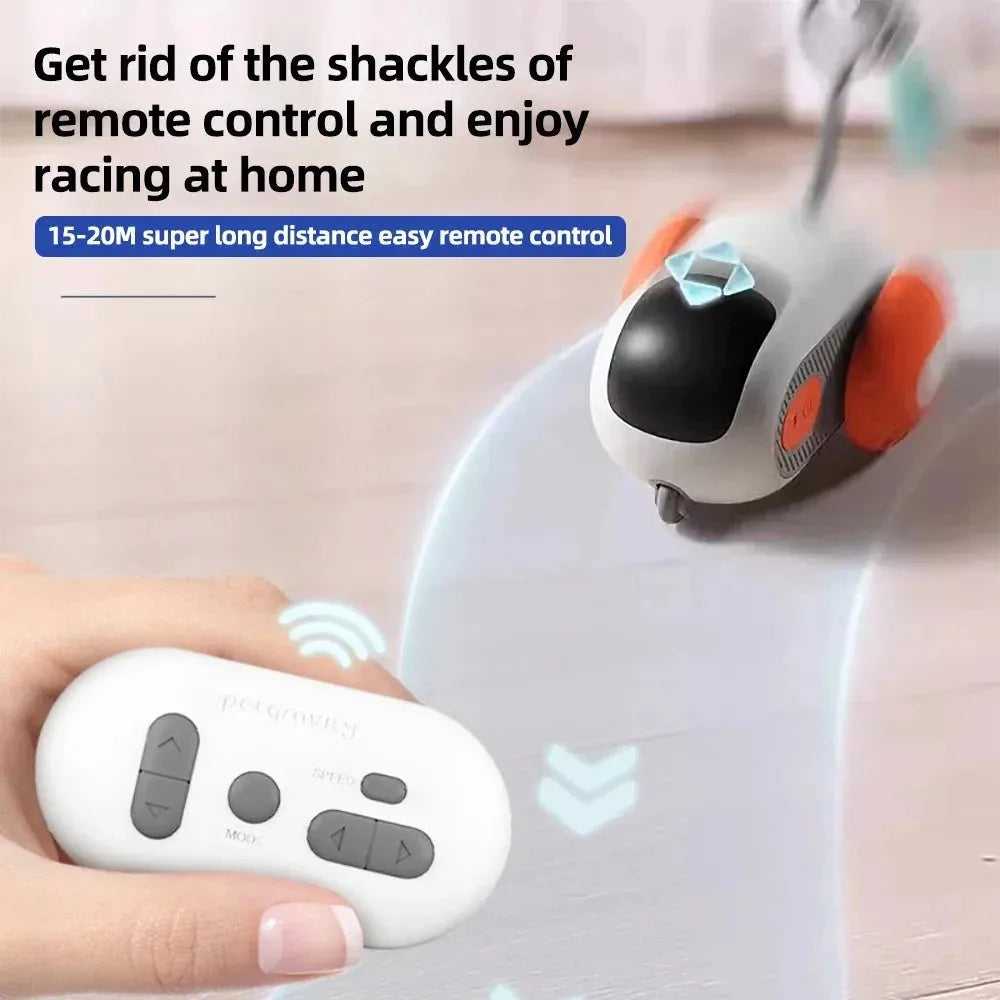 Blue smart cat toy car with feather teaser attachment and remote control on floor