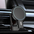 Black and white magnetic wireless charger on a desk with charging cable.