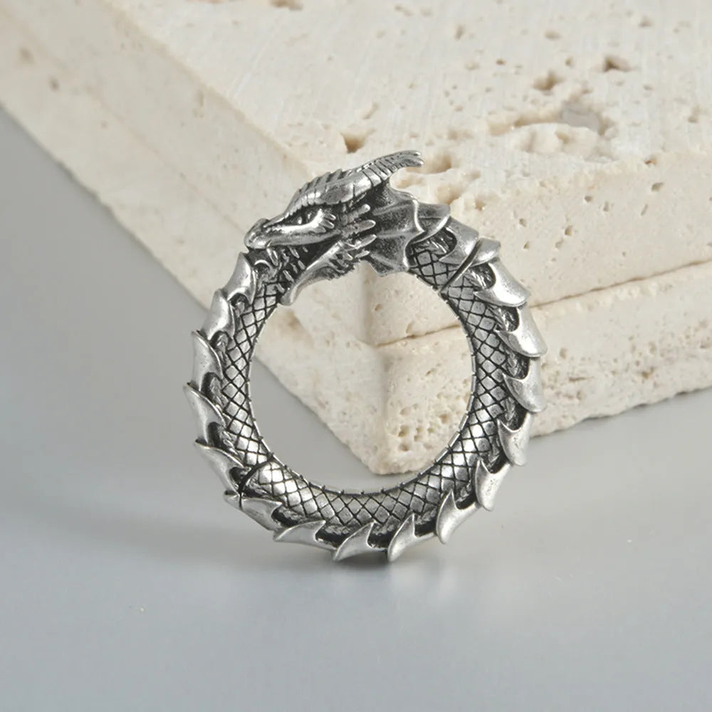 Large dragon-shaped hollow-out earrings in antique silver finish