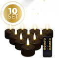Four black plastic LED tealight candles showing their size and colour.