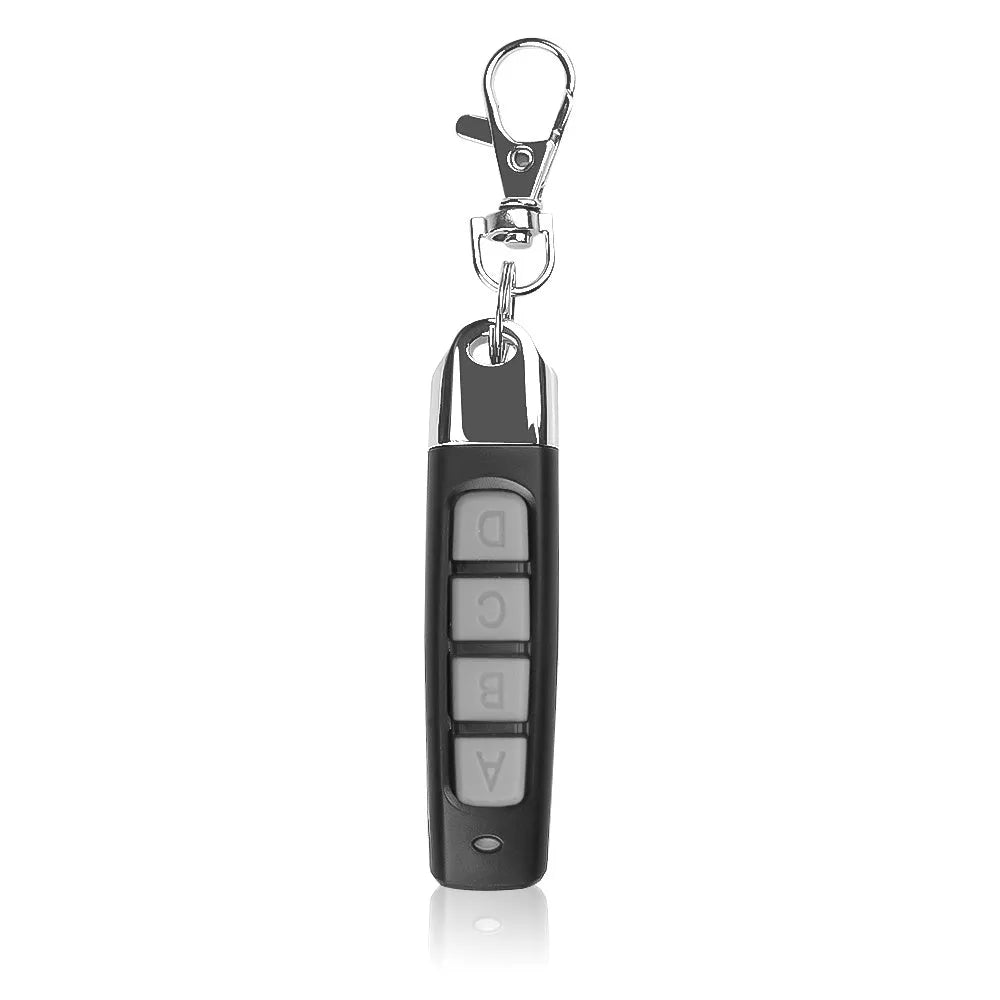 Rolling door remote control unit in choice of black, blue, grey, or red colours showing compact 6.7cm design