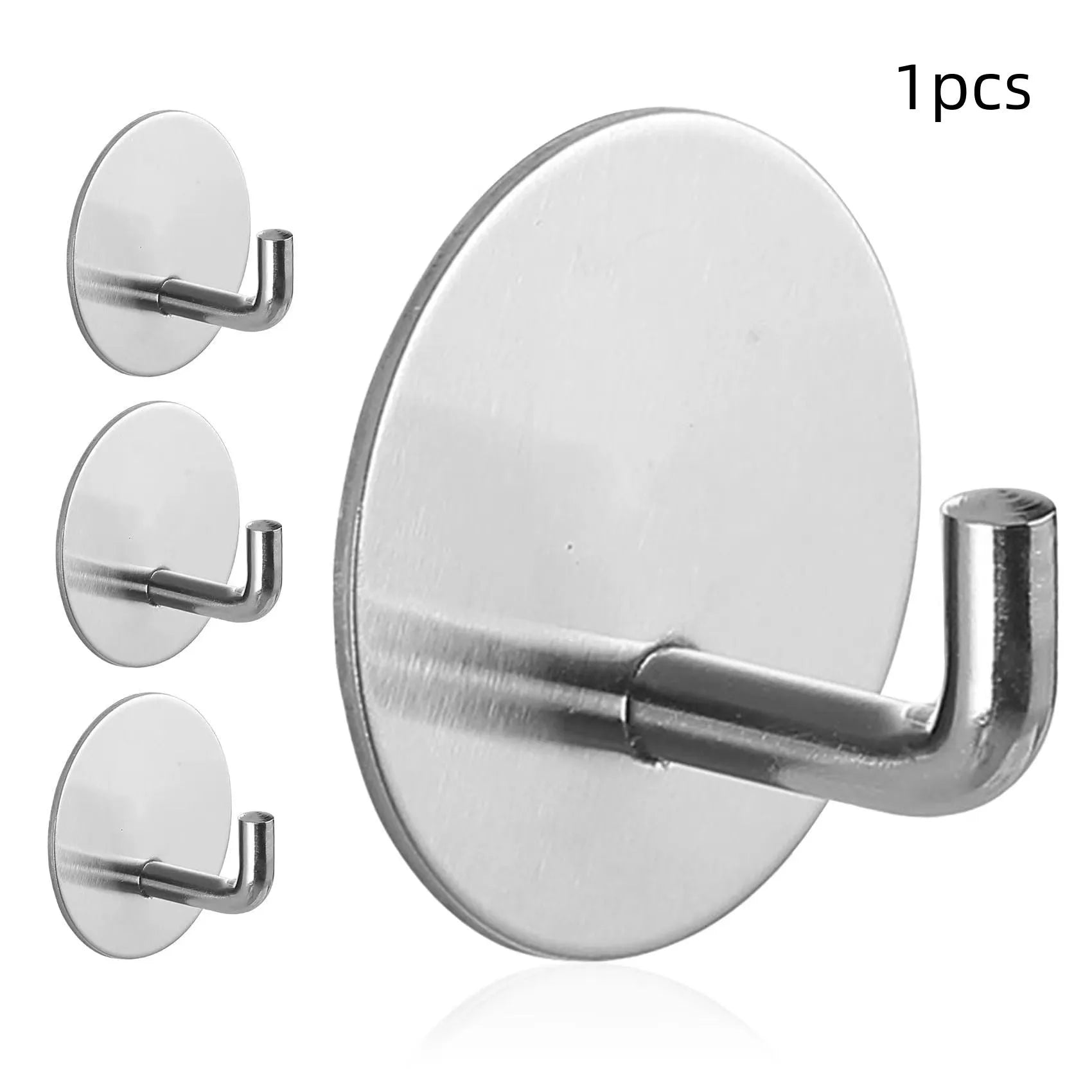 Two round stainless steel self-adhesive wall hooks, one black and one polished, on a white background.
