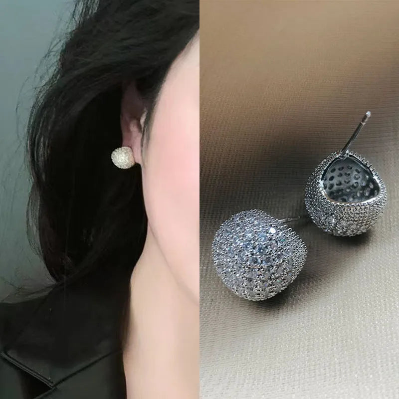 Gold and white geometric drop earrings with little golden beans design and ear clip fastening