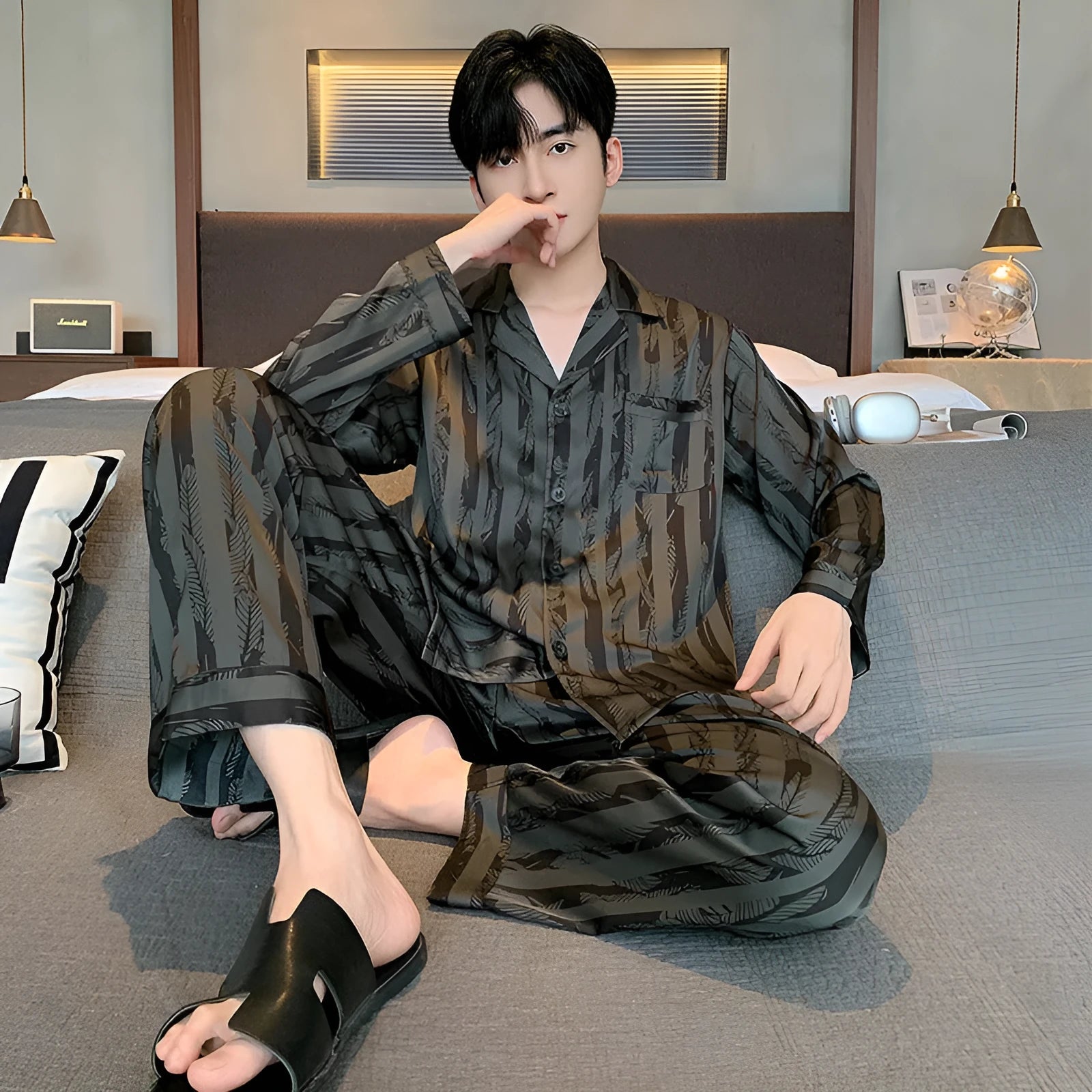 Men's black striped Ice Silk pajama set with long sleeves and trousers.