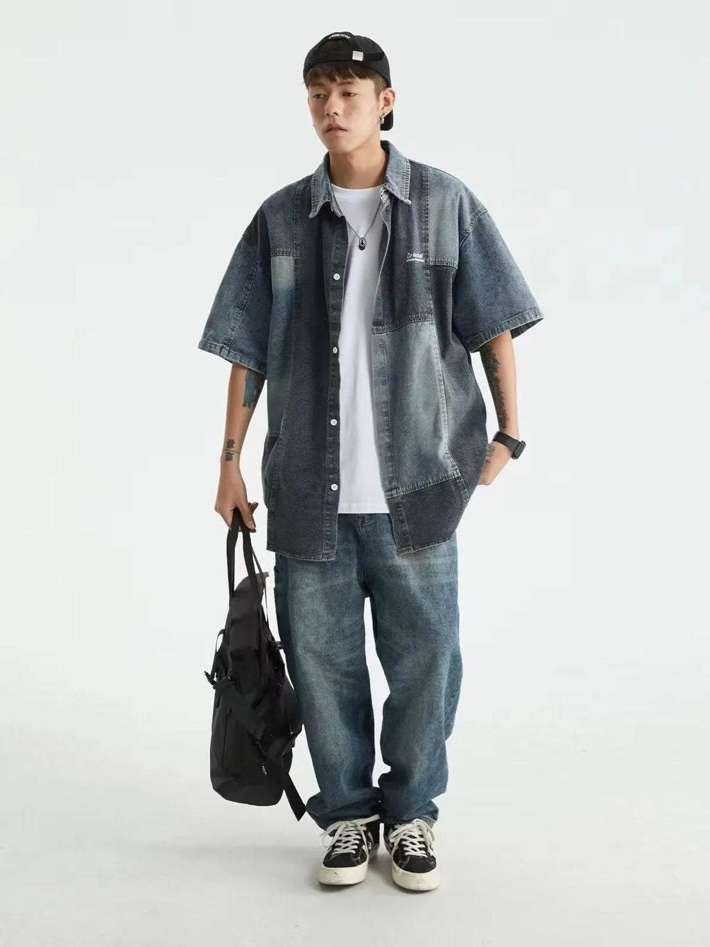 Blue loose-fit men's denim shirt with Japanese retro washed stitching detail.
