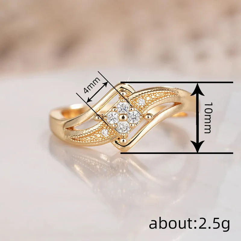 Diamond-shaped yellow gold tone copper ring with micro-inlaid zircon stones on finger