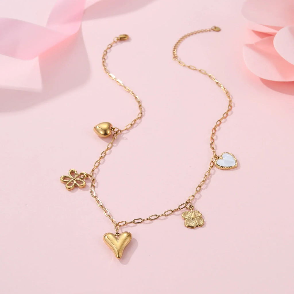 Stainless steel necklace with geometric sun pendant on an adjustable chain.