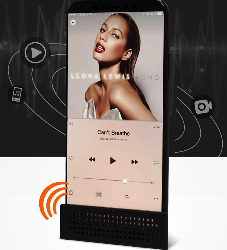 Mini black ABS plastic mobile phone amplifier bracket holding a smartphone on a desktop.