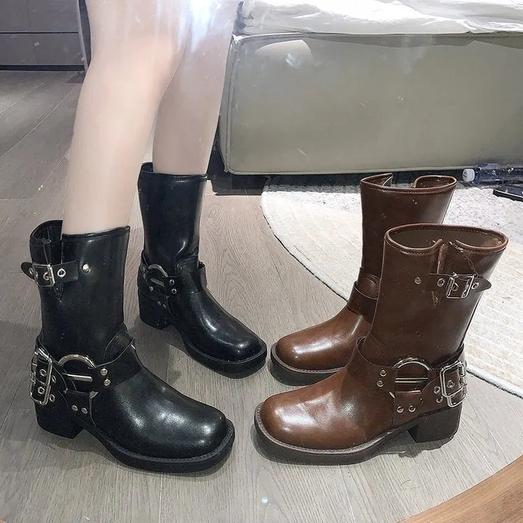 Women's black platform boots with buckle detailing and mid-calf length