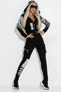 Black women's casual suit with wings print on hooded zip-top and matching trousers.
