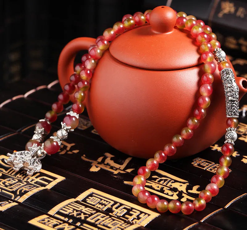 Natural watermelon crystal bracelet with Chinese knot and geometric elephant-style beads