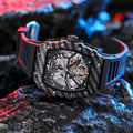 Men's mechanical watch with luminous hands on a rubber strap, showing a see-through case back.