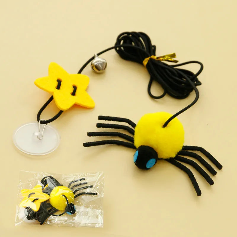 Red cat door hanging toy with swinging elastic rope, feather attachment, and bell spider