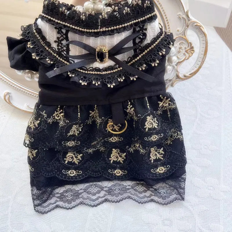 Golden Gothic-style princess skirt costume for a small dog or cat on a mannequin.