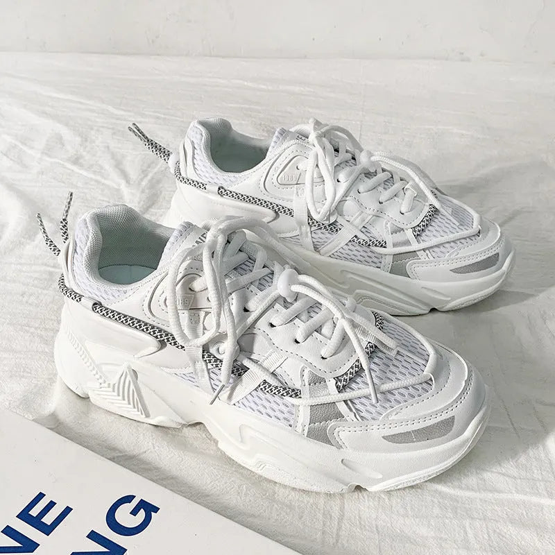 Men's white platform sneakers with lace-up front, shown on a neutral background.
