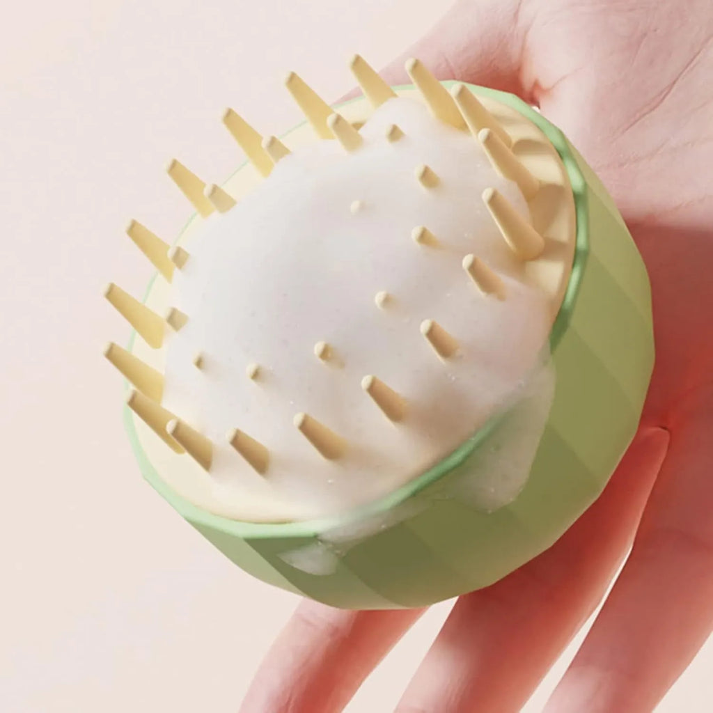Green pet shampoo brush for dog and cat bathing with dual-sided design and water drain holes