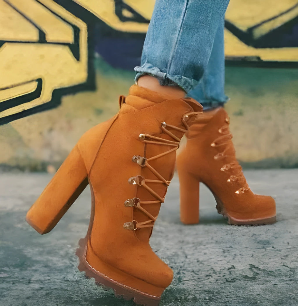 Women's army green suede high-heel boots with round toe, thick heel, belt buckle, and rivet details.