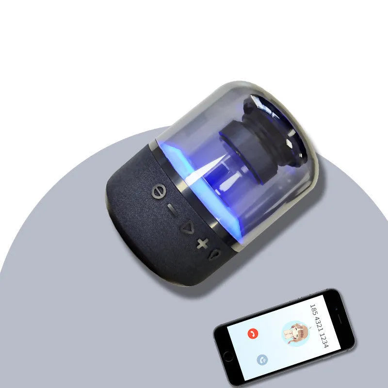 Black Four-Colour Light Touch Wireless Bluetooth Speaker with illuminated controls on a dark surface.