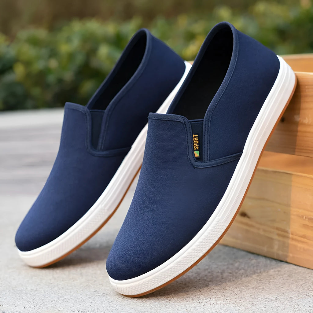 Men's black low-top canvas slip-on shoes with round toe and composite sole