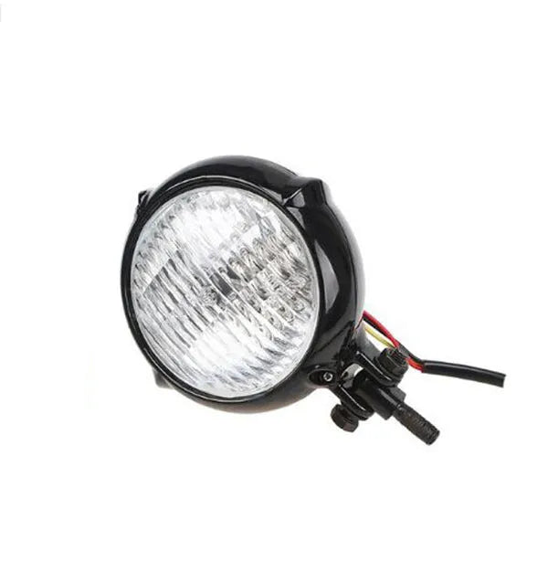 Black retro motorcycle headlight with 8 cm diameter lens and cast aluminium housing