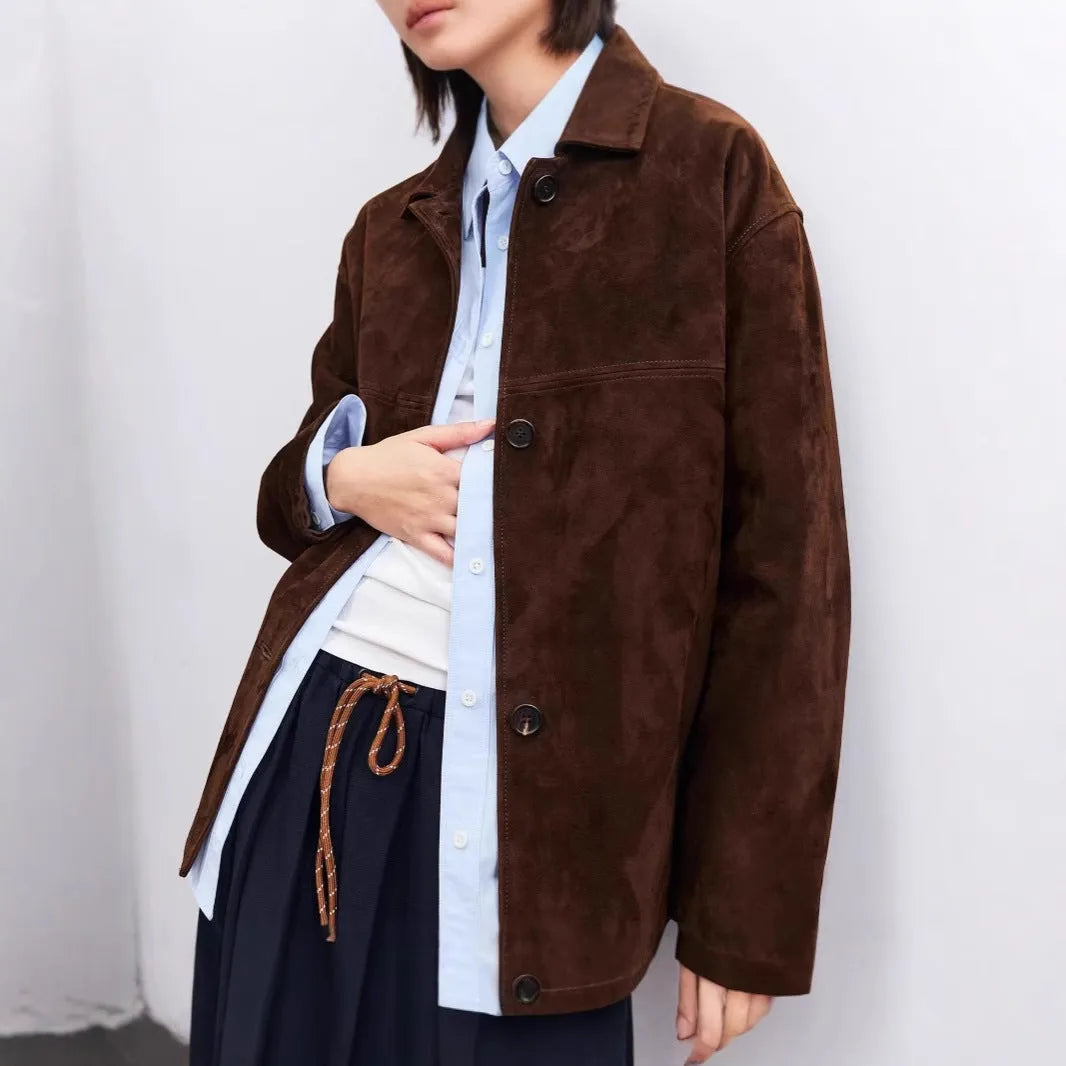 Women's retro style cashmere coat with Peter Pan collar and leather stitching details in loose fit mid-length design