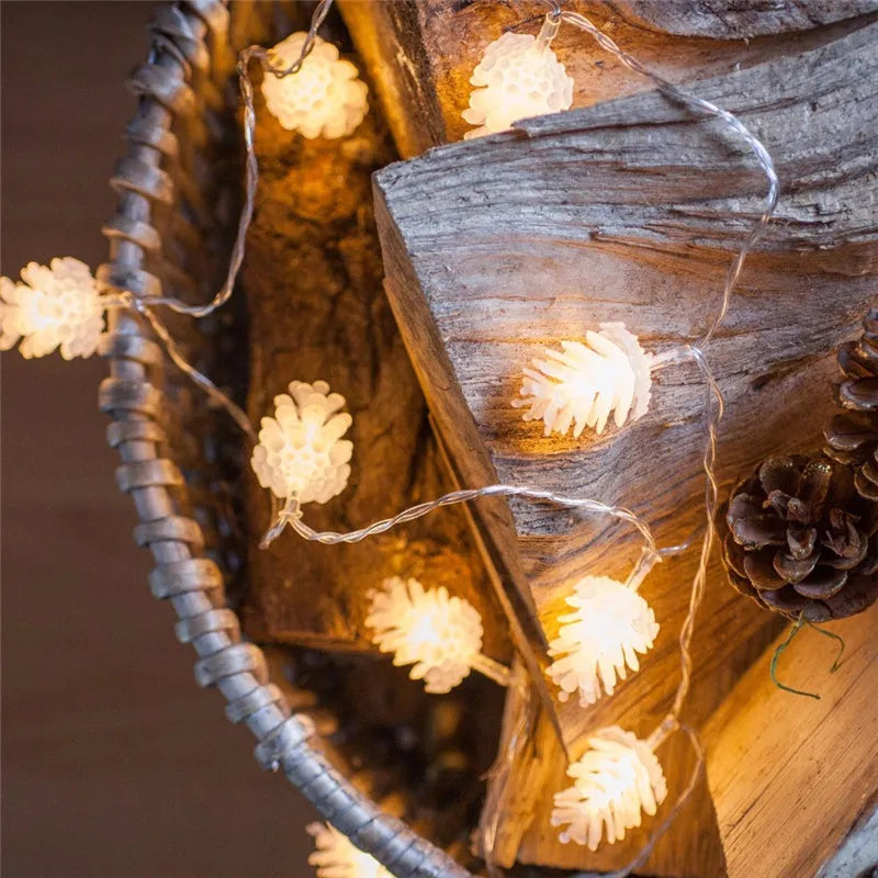 Warm white LED pine cone decorative light string powered by AA batteries