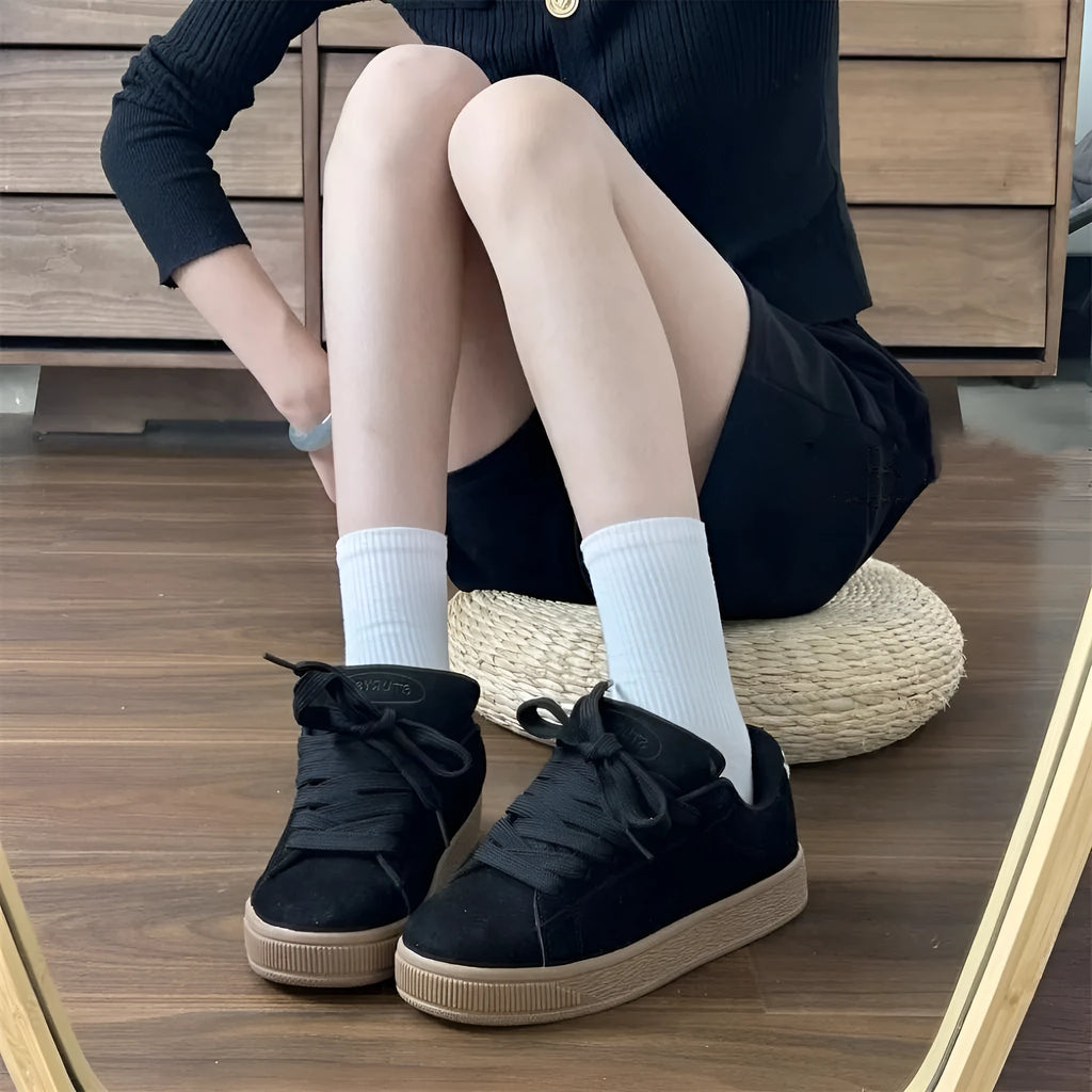 Black retro low-top sneakers with waterproof platform soles and round toe design