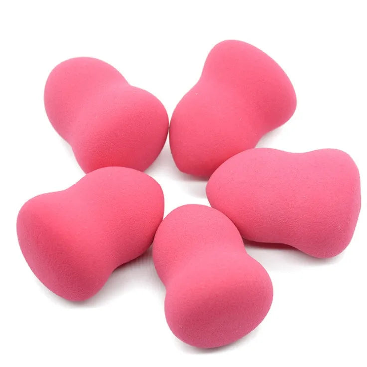 Pink hydrophilic non-latex makeup sponge measuring 4cm by 4cm by 5.6cm.