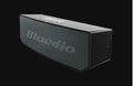 Black cloud smart speaker with compact design showing dimensions and Micro-USB charging port