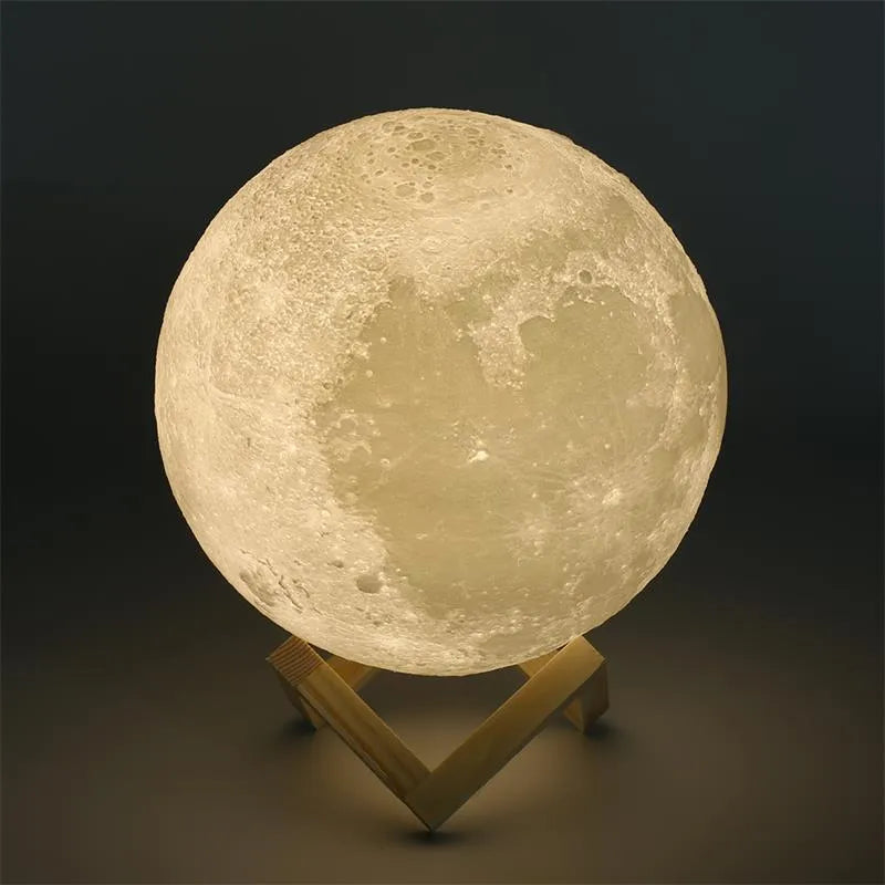 3D printed white moon lamp with detailed craters on a wooden stand, showing touch ring at base.