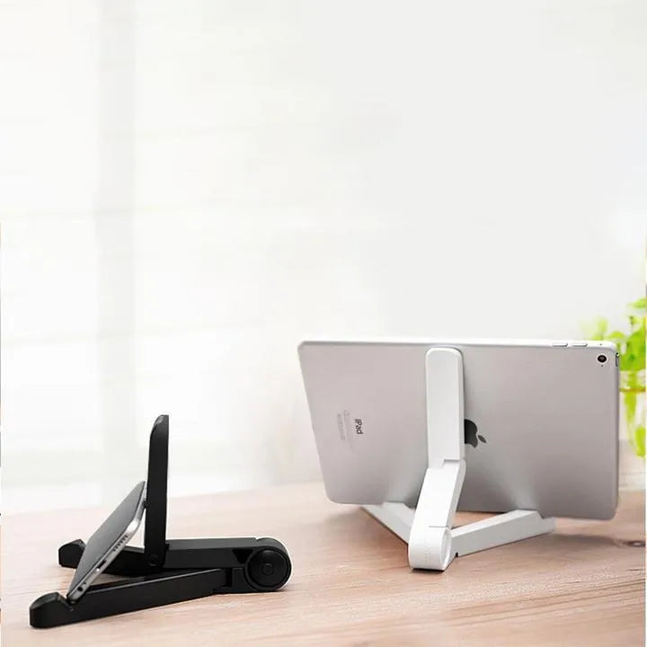 Black foldable aluminium tablet holder shown open and folded flat next to a smartphone