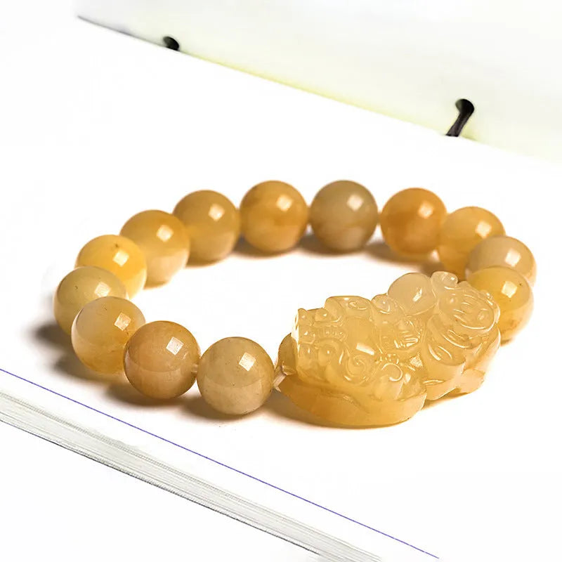 Hand-carved golden thread jade money coin bracelet with jade beads in two size options.
