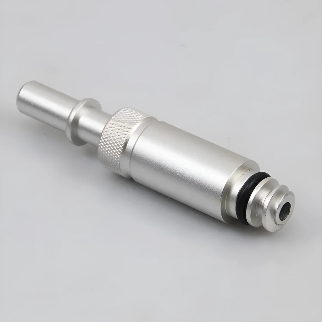 Silver metal transmission refuelling joint for automotive workshop use.