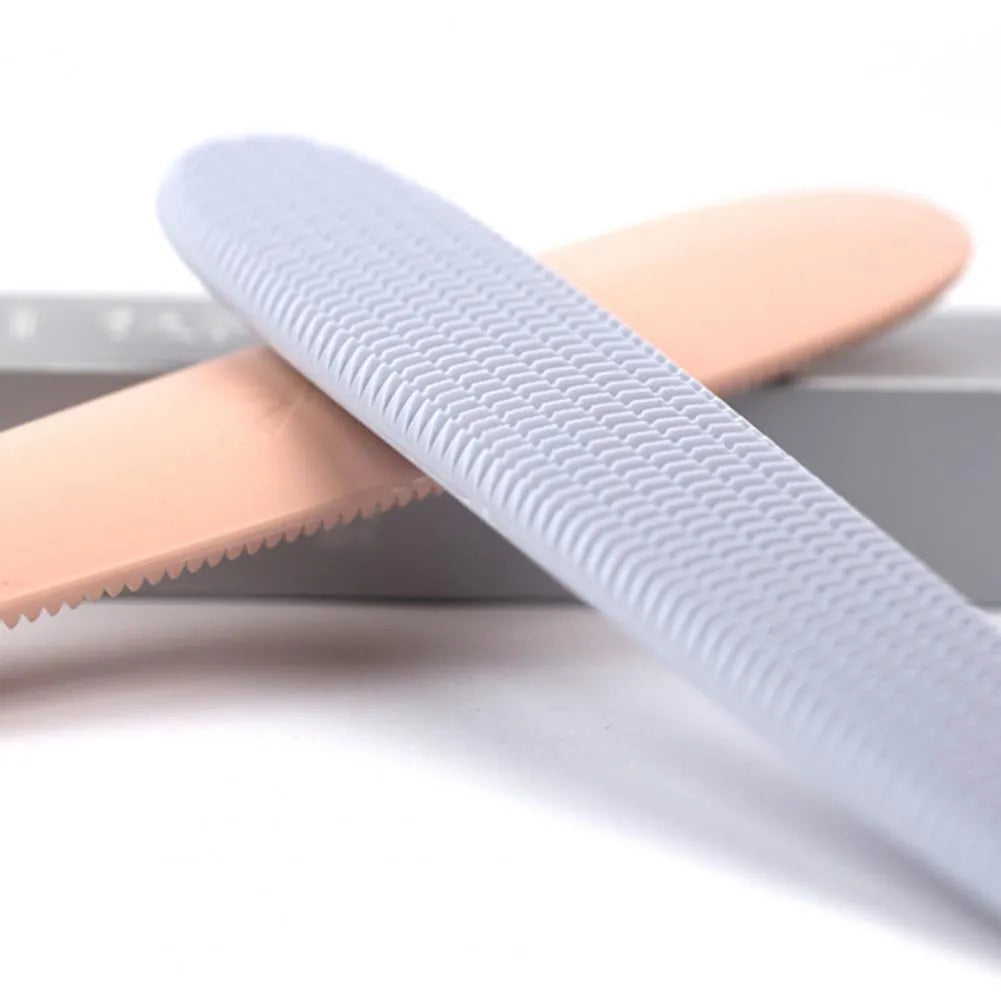 Grey and pink ABS cat grooming comb with tongue massage design and dual-ended grooming surfaces
