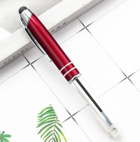 Red metal multifunctional stylus ballpoint pen with LED light and capacitive tip.