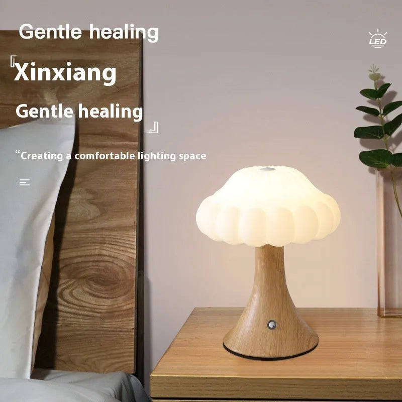 Mushroom shaped touch control rechargeable LED lamp in wood grain colour on table