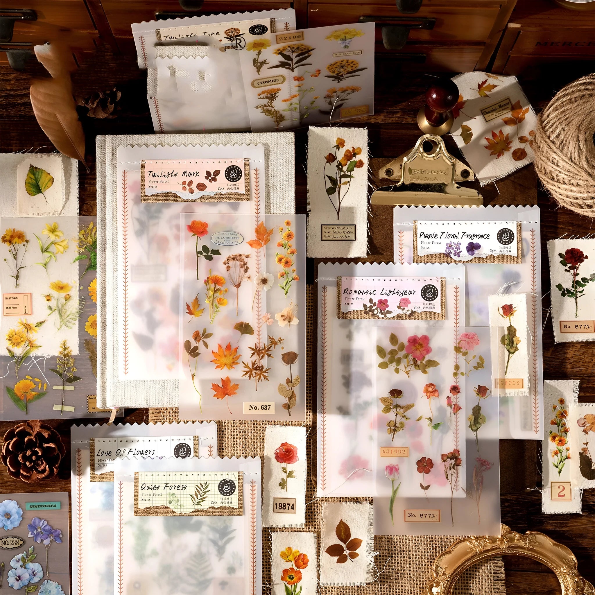Huazhisen art sticker material pack showing printed transfer paper and cotton linen sheets in forest and romantic designs.