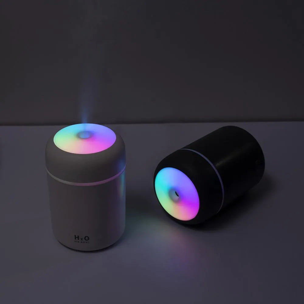 Pink USB desktop humidifier with mood lights and water tank
