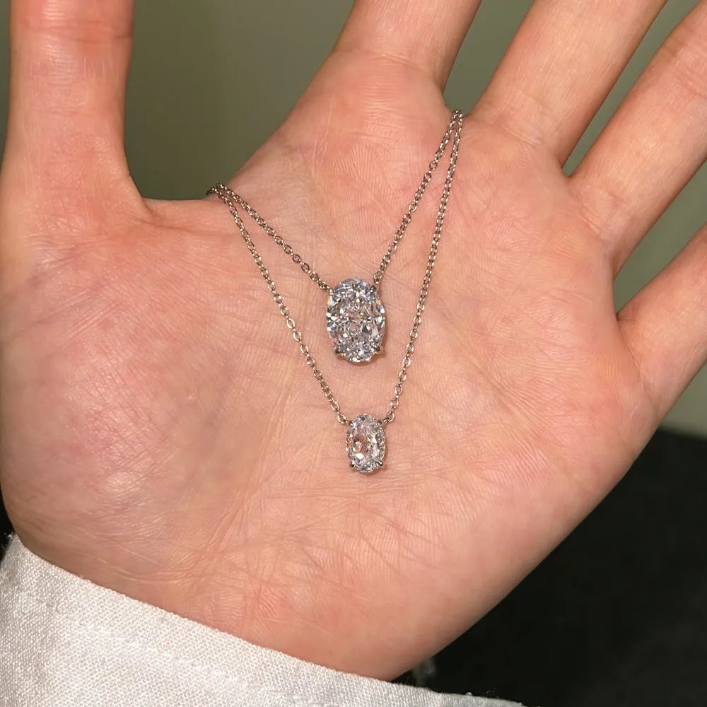 Oval ice flower geometric pendant necklace in sterling silver with platinum or gold electroplated finish.