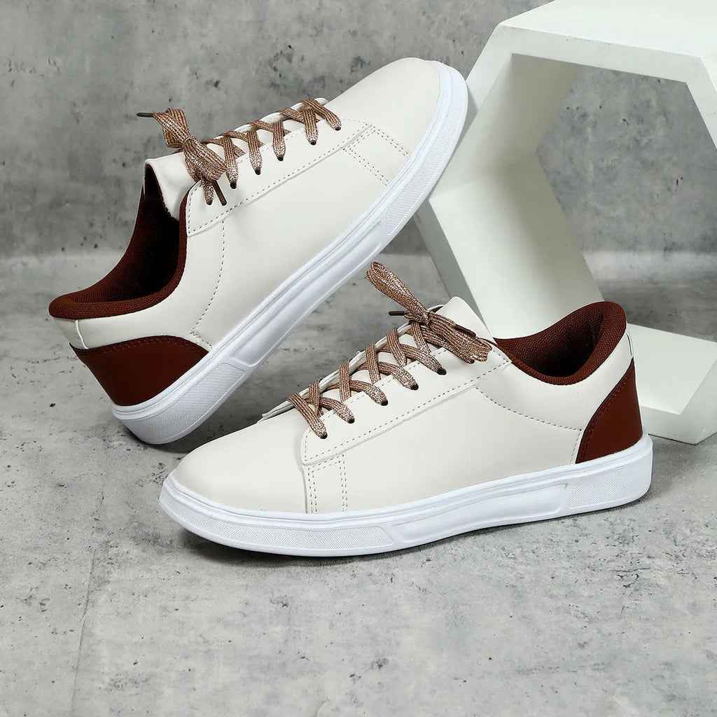 Casual platform sneaker with cross strap detail on artificial PU upper in beige brown colour