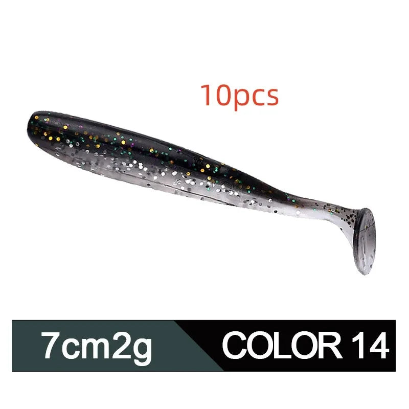 Close-up of a two-tone T-tail soft plastic fishing lure measuring 7cm, shown in a vibrant colour pattern.