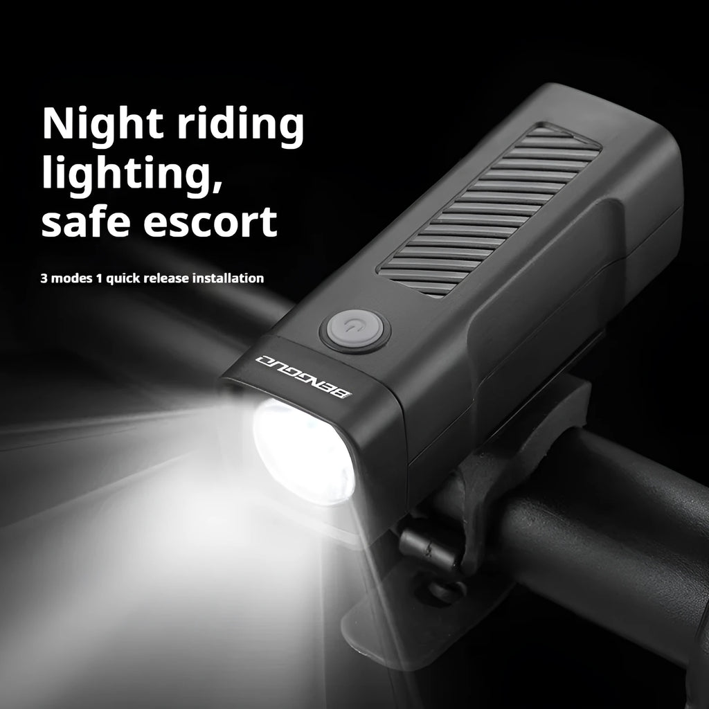 Black USB rechargeable bicycle headlight with LED and quick-release strap mount on handlebars.