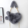 Medium soft plush heart handbag in solid color with zipper closure and shoulder strap option for women