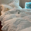 Washed cotton linen four-piece bedding set in solid colour with quilt cover, fitted sheet and pillowcases