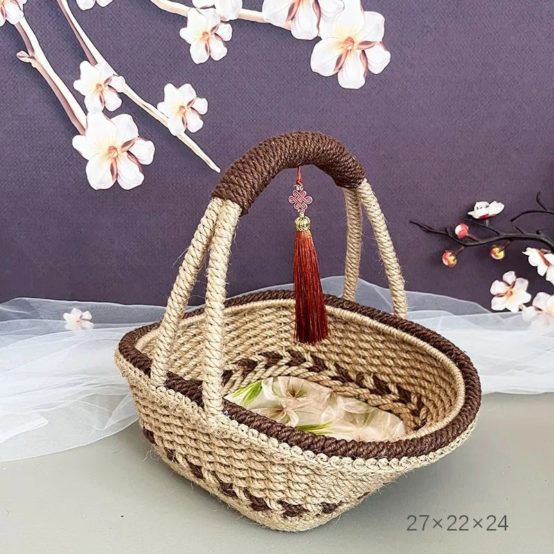 A hand-woven straw basket in a coffee brown colour, measuring 19cm by 12cm.