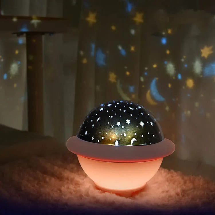 UFO-shaped LED projection night light in green, pink or white colours projecting starry sky patterns