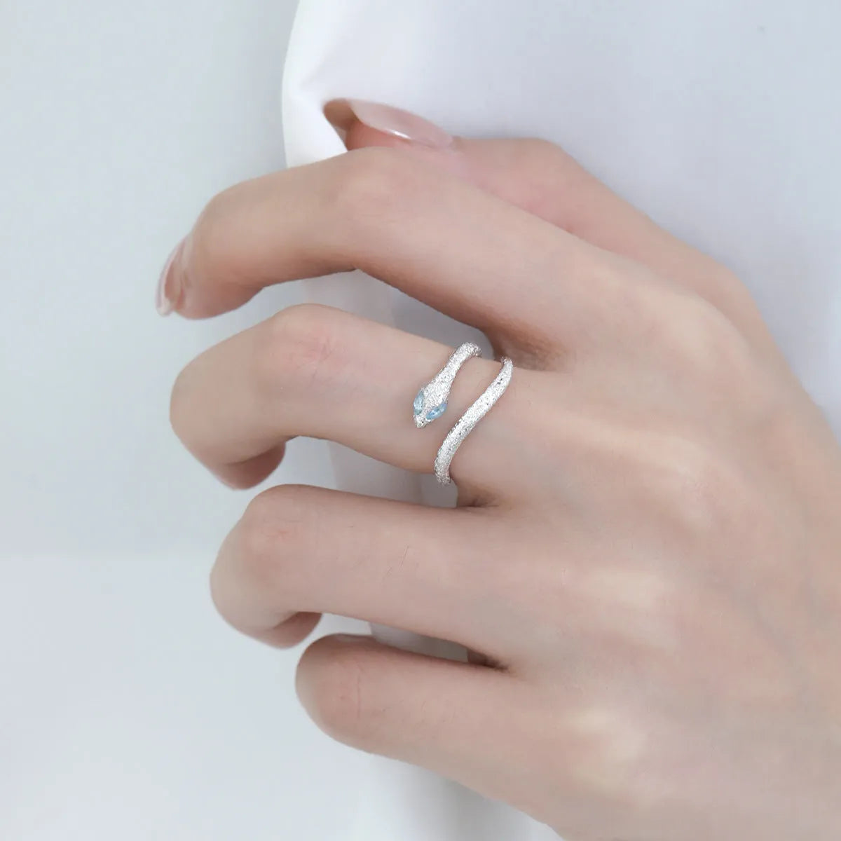 Adjustable silver ring with platinum colour finish and snake zodiac design for women