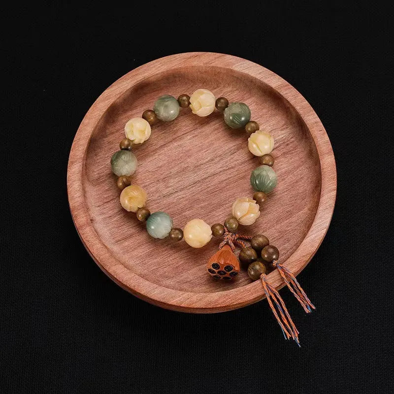 Carved bodhi root pumpkin lotus bracelet with white jade beads and mixed sizing
