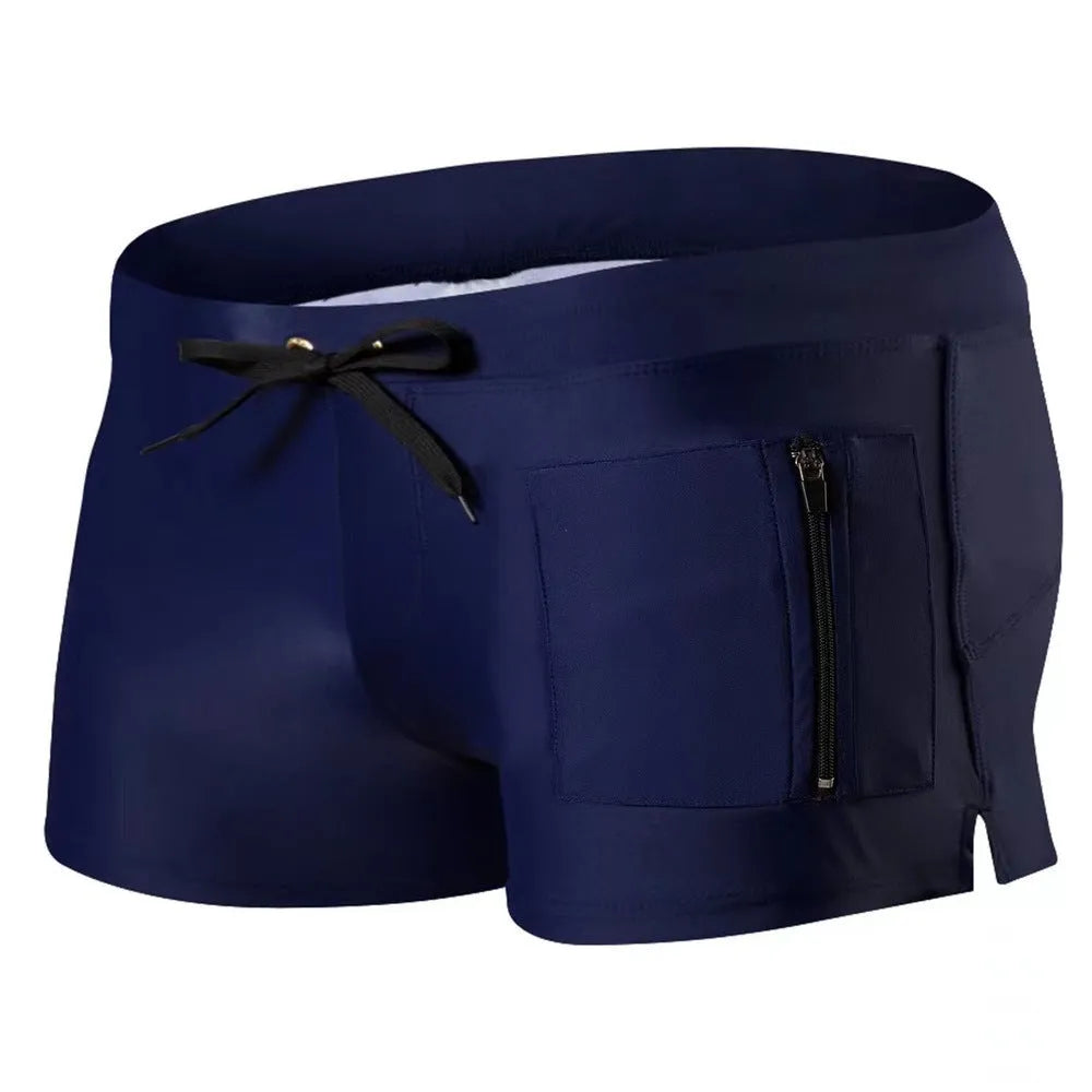 Men's high-waist lace-up polyester swimming trunks in solid colour on mannequin.