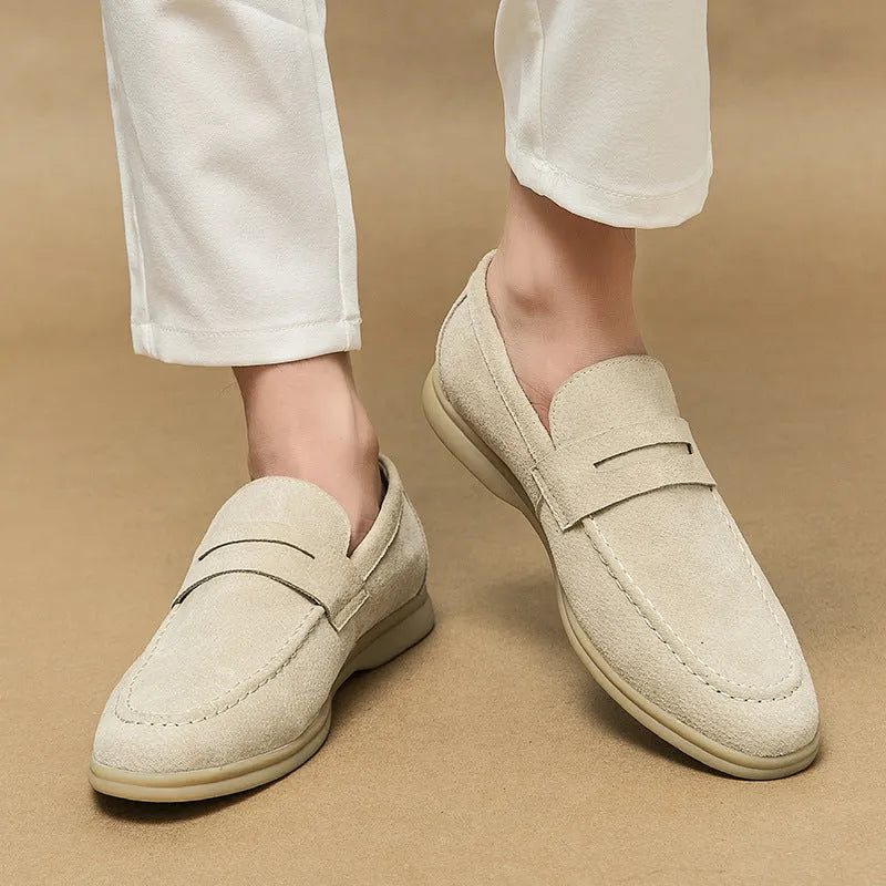 Men's leather slip-on casual shoes in beige with a rounded toe and rubber sole.